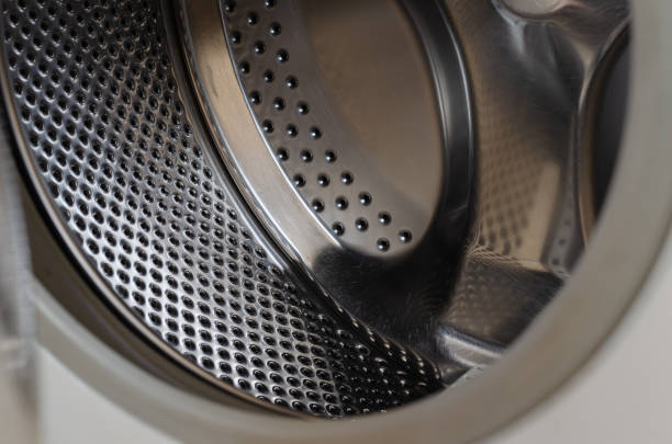 Shiny drum with scratch marks. Close-up. Selective focus.