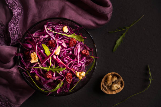 istock Delicious red cabbage salad. Cut red cabbage with other ingredients 1206882422