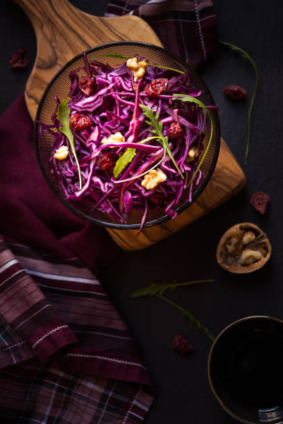 istock Delicious red cabbage salad. Cut red cabbage with other ingredients 1206882463