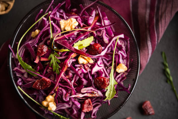 istock Delicious red cabbage salad. Cut red cabbage with other ingredients 1206882493