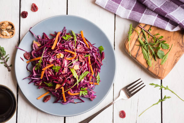 istock Delicious red cabbage salad. Cut red cabbage with other ingredients 1206882528