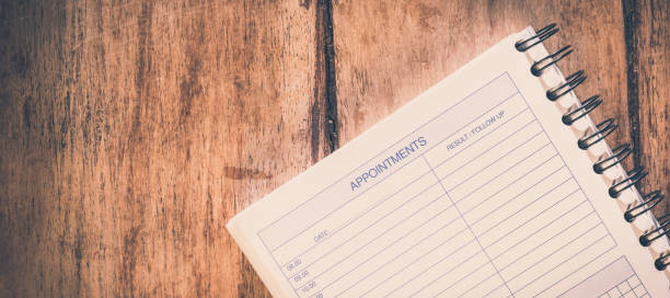 istock Task checklist in project management concept, pen on white paper notepad with handwritten headline as Task List and numbers listed on wood table, writing business project with tasks prioritize. 1206882563