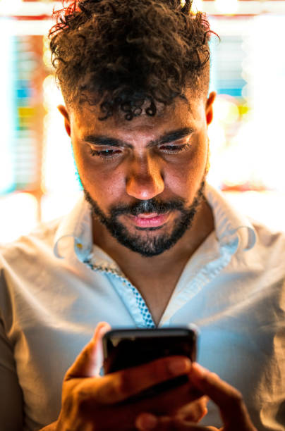 istock Reading a phone message on a night out 1206882889