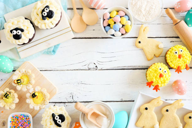 istock Easter or spring baking scene of various sweets and cookies, above view frame over a white wood background 1206884556
