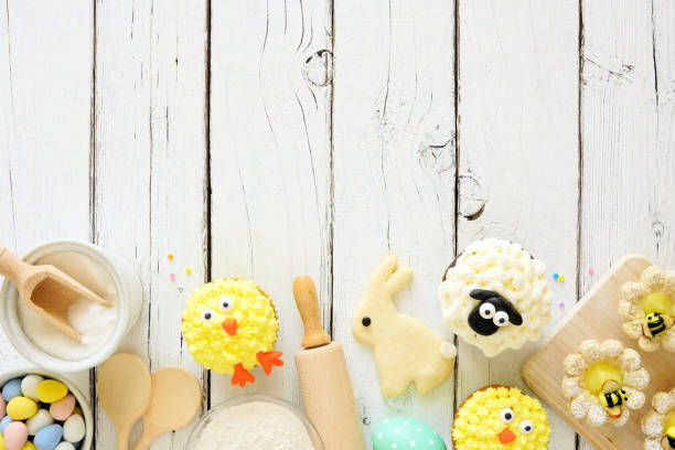 istock Easter or spring baking scene of various sweets and cookies, top view bottom border over a white wood background 1206884668