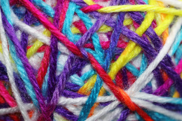 istock Colorful threads criss-cross together 1206886086
