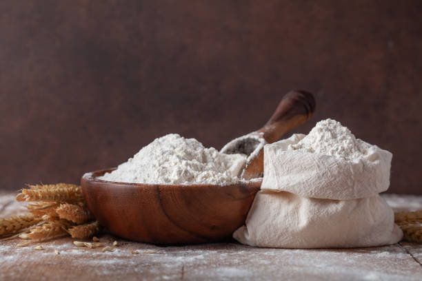 istock Wheat flour in cotton bag on wooden table. Ingredient for baking. 1206887515