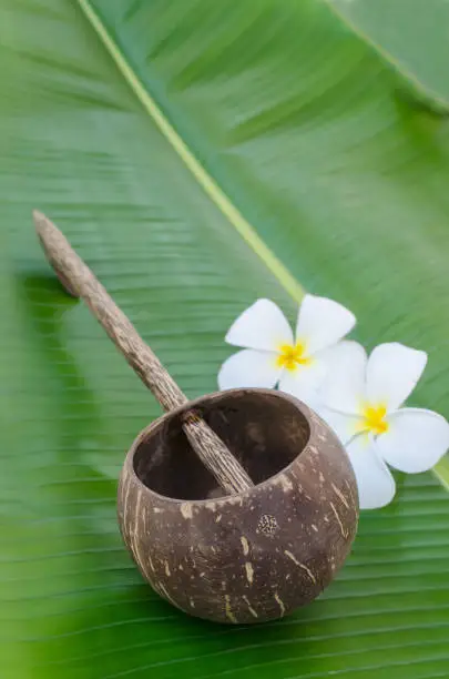Old thai style coconutshell ladle on banana leaf