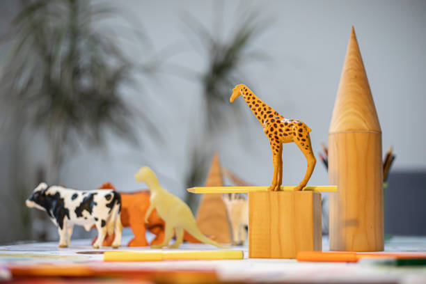istock Composition of geometric figures and plastic toy animals 1206889550