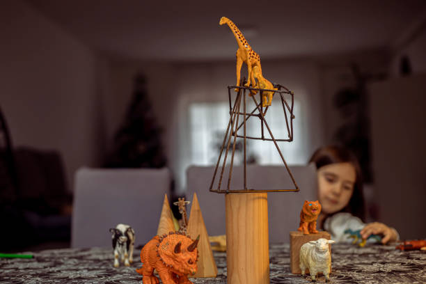 istock Composition of geometric figures and plastic toy animals 1206891028