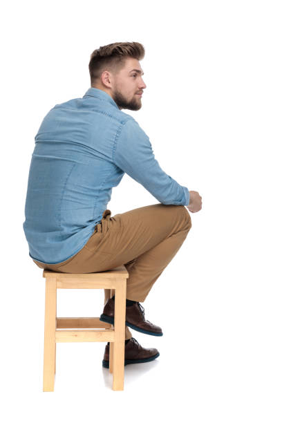 istock casual young guy in denim shirt looking to side 1206891383