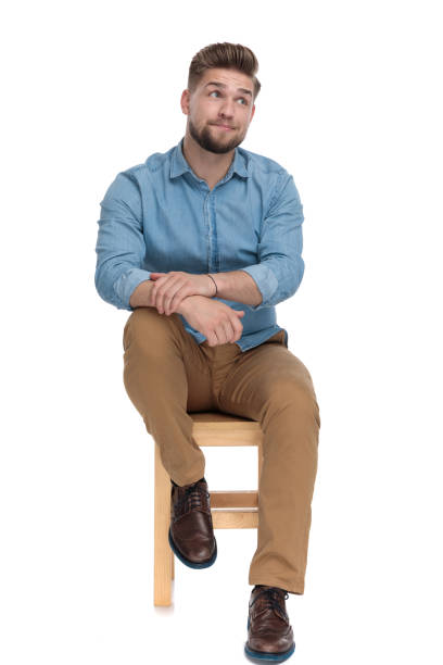 istock funny young model in denim shirt making silly face 1206891684