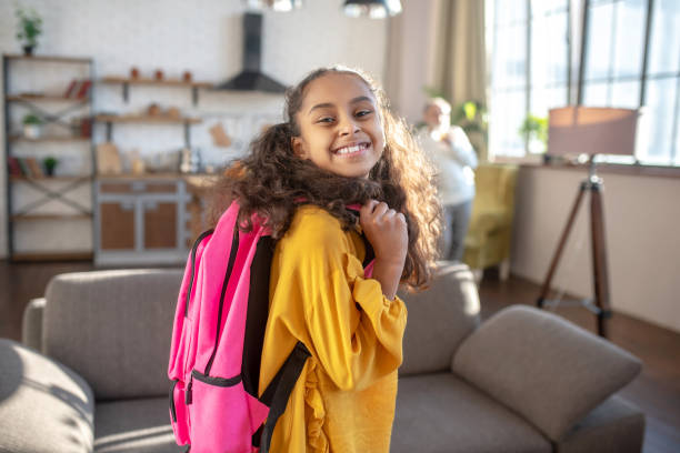 istock Cute dark-skinned girl with curly hair feeling happy 1206891994