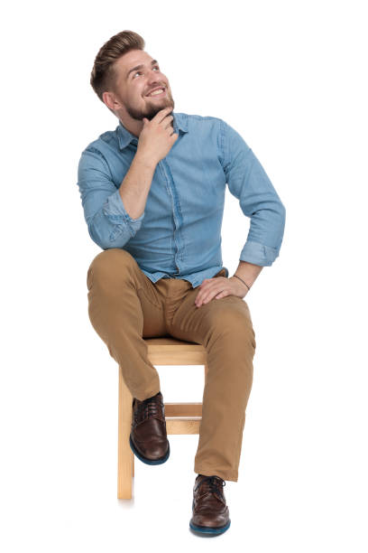 istock happy casual man looking up and smiling 1206893151