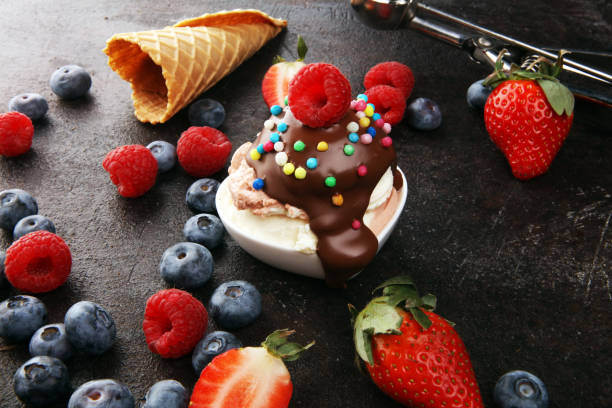 istock Vanilla ice cream scoops with fresh berries. Strawberries, raspberries with ice cream 1206893406