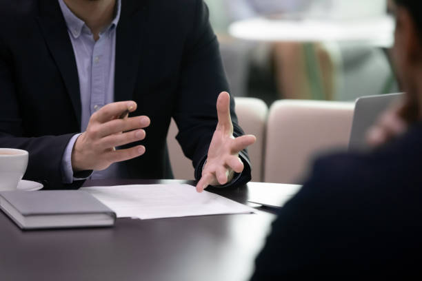 istock Close up businessman negotiating explaining agreement details to partner. 1206893423