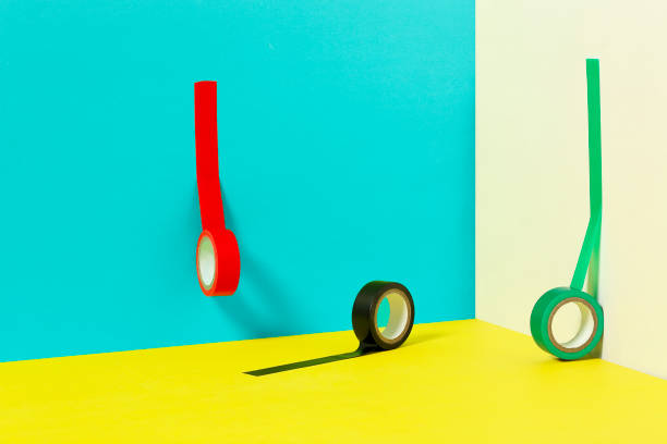 three colorful insulating tapes on walls and floor of different color, creativity concept