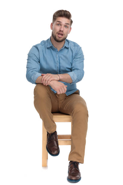 istock shocked young model wearing denim shirt 1206893503