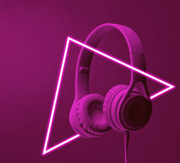 istock Fashinable headphones. 80's synth wave and retrowave glowing triangle futuristic aesthetics. Old fashioned abstraction concept 1206894417