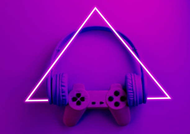 istock Gmer concept. Gamepad with headphones. 80's synth wave and retrowave glowing triangle futuristic aesthetics. Old fashioned abstraction concept 1206894444