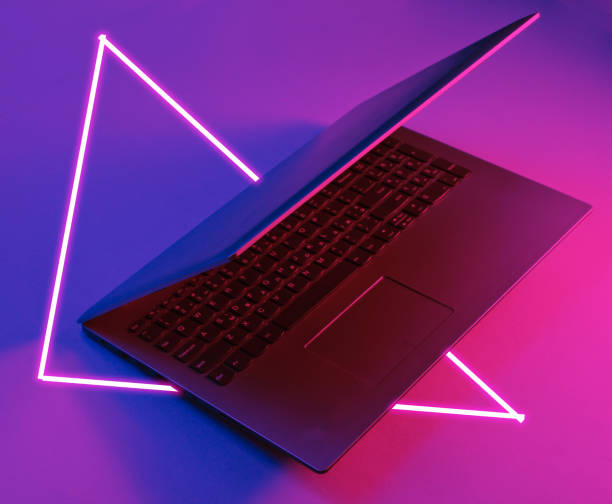 istock Modern laptop. 80's synth wave and retrowave glowing triangle futuristic aesthetics. Old fashioned abstraction concept 1206894503