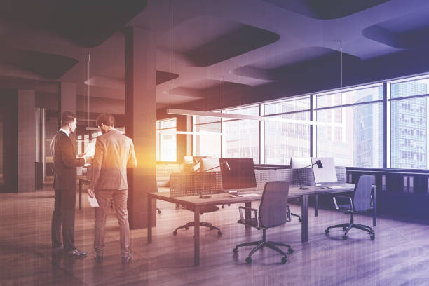 istock Business people in gray open space office 1206894905