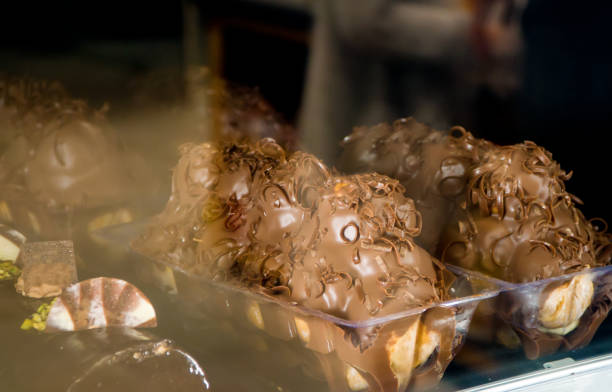 Close-up view of Profiterole with milk chocolate log.