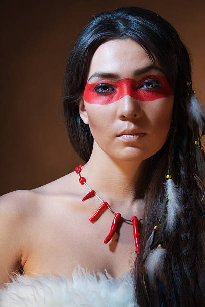 istock American Indian with paint face camouflage 120689537