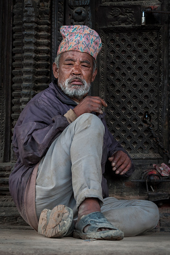 Unidentified Newari Nepalese man in Bhaktapur, Nepal, listed as a World Heritage by UNESCO for its rich culture, temples, and wood artwork