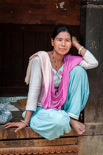 Unidentified Nepalese woman in Bhaktapur, Nepal, listed as a World Heritage by UNESCO for its rich culture, temples, and wood artwork