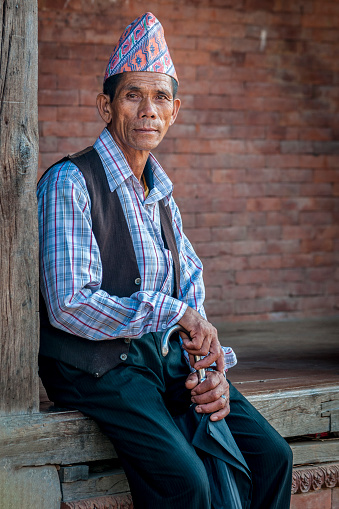 Unidentified Newari Nepalese man in Bhaktapur, Nepal, listed as a World Heritage by UNESCO for its rich culture, temples, and wood artwork
