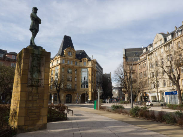 istock Statue and old buildings on a square 1206897212