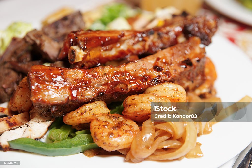 Grilled pork ribs and shrimps Grilled pork ribs and shrimps, close-up Rib - Food Stock Photo