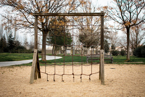 Wooden staircase with iron chain steps located in an exercise park