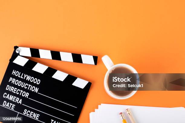 Movie Clapper Board On Orange Background With Copy Space Stock Photo - Download Image Now