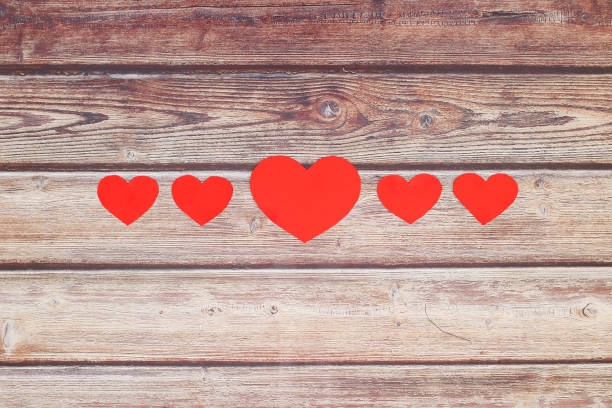 istock Happy Valentine's day - Romantic paper hearts on the table 1206898257