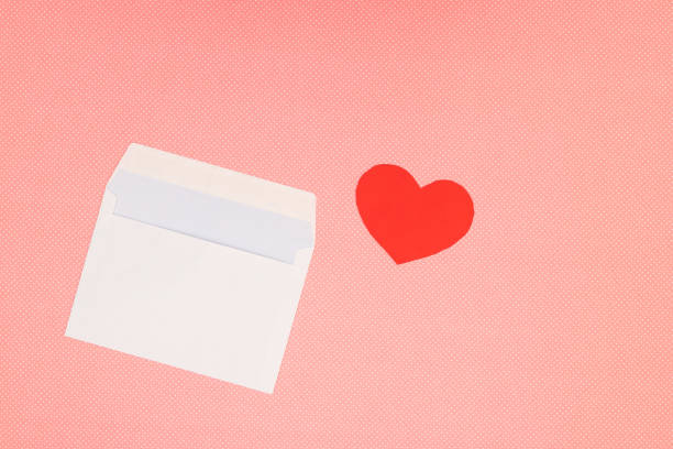 istock Red heart for Valentine's day and white envelope on pink background 1206899172
