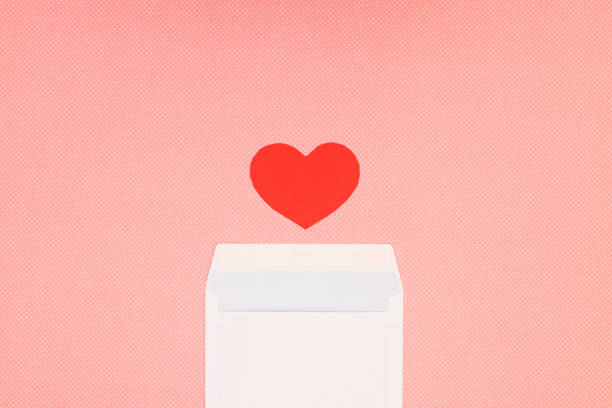 istock Red heart for Valentine's day and white envelope on pink background 1206899228
