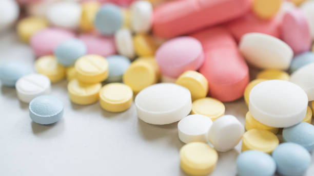 pastillas sedantes de primer plano analgésicos - generics fotografías e imágenes de stock