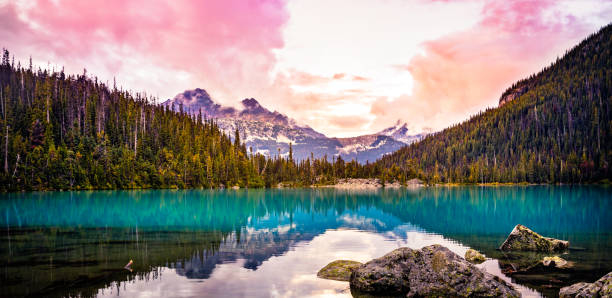 Colorful Mountain sunset view at Upper Joffre Lake Colorful Mountain view of Mount Cayoosh and Upper Joffre Lake at sunset in British Columbia, Canada pemberton bc stock pictures, royalty-free photos & images