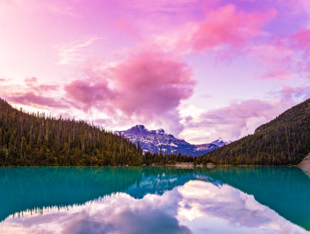 Pink Mountain sunset  at Upper Joffre Lake Beautiful Pink Clouds and Mountain view of Mount Cayoosh at Upper Joffre Lake at sunset in British Columbia, Canada pemberton bc stock pictures, royalty-free photos & images
