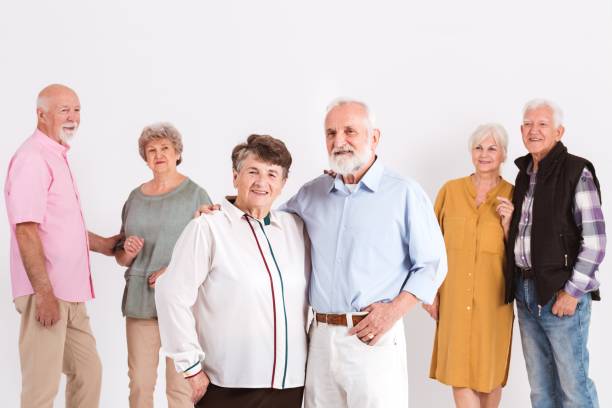 istock Group of seniors standing in room 1206902048