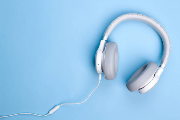istock Headphones on blue background. Flat lay top view. Music concept. Copy space. 1206902167