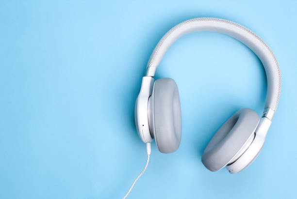 istock Headphones on blue background. Flat lay top view. Music concept. Copy space. 1206902170
