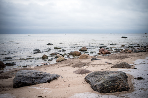 Baltic Sea, eautiful sea level with fantasy dark sky, high resolution full frame photo, rocky beach