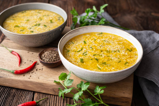 Quick and simple spicy egg drop soup with parsley and chilli stock photo