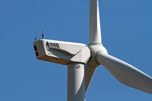 istock Windmills for electric power production. A wind turbine is a device that converts the wind 1206903721