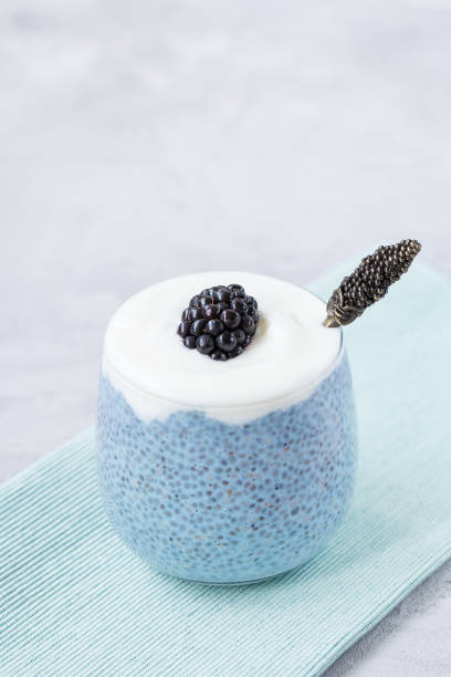 istock Blue chia seed pudding with blackberry in glass 1206904273