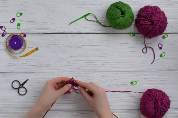 istock Background with knitting and crocheting tools and accessories, woman hands working 1206906078