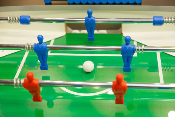 istock Foosball ball on table football table with figures 1206906741